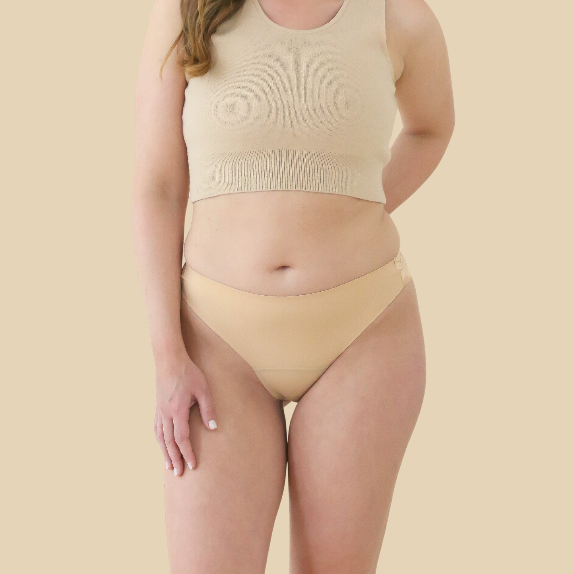 dais daily underwear in brazilian cut with lace in beige colour. Product shown on model from the front. 