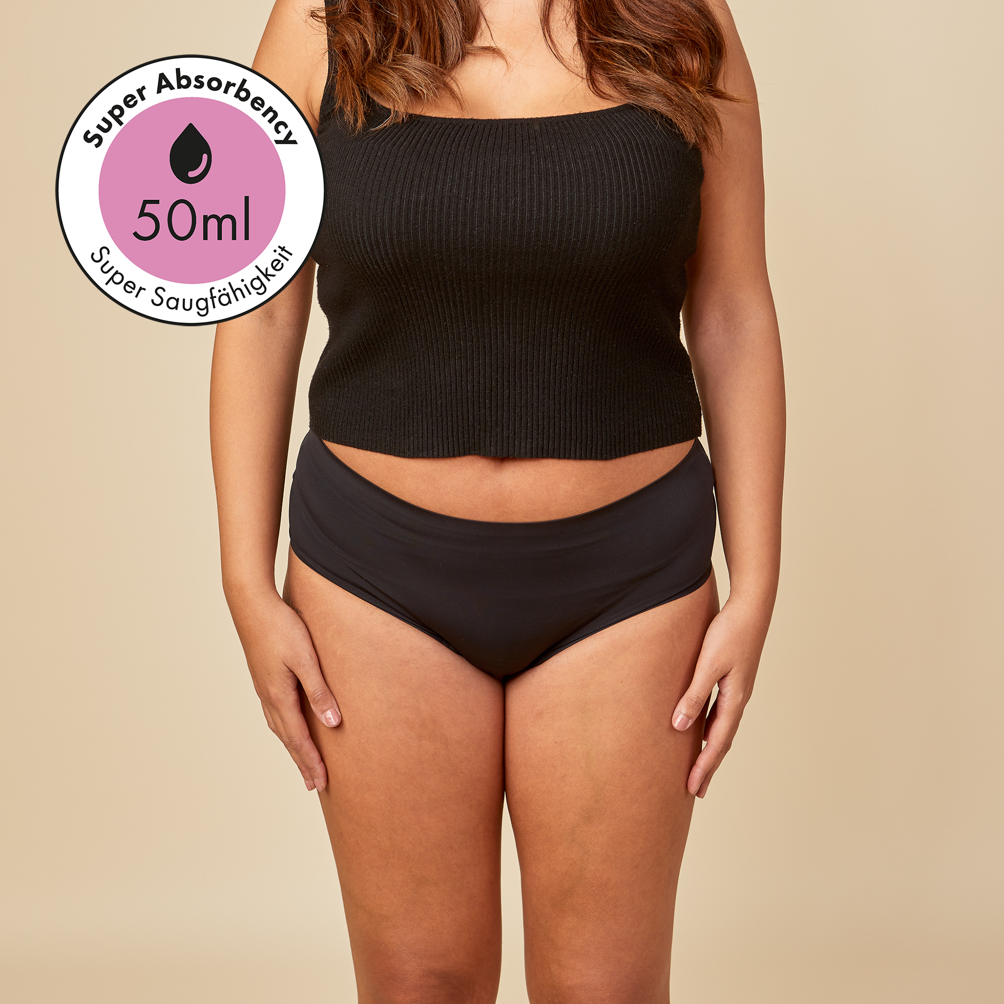 dais absorbent underwear for bladder leaks in high waist cut in black colour shown on model from the front. Super absorbency from up to 50ml. 
