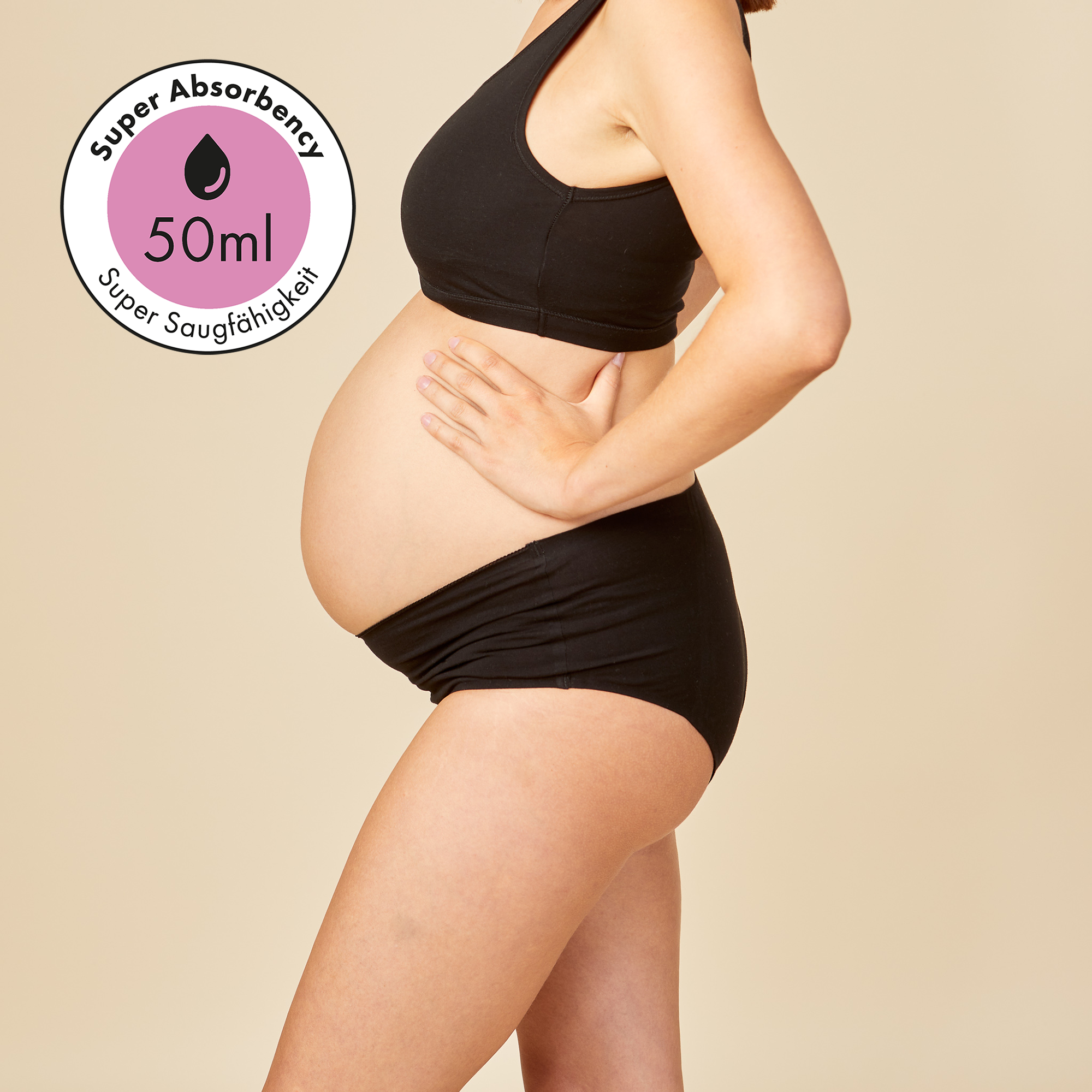 dais maternity absorbent underwear in high waist cut in black. Shown on pregnant model from the side with super absorbency of 50ml. 